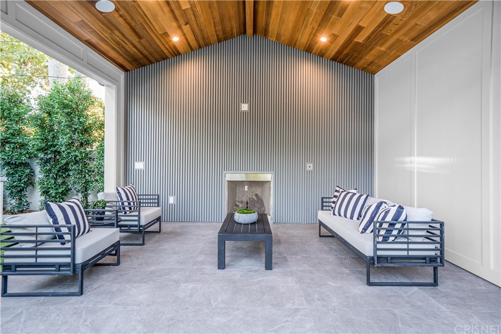 11201 Valley Spring Lane Studio City, CA 91602 - Photo 11 of 14 a living room with furniture and a large window