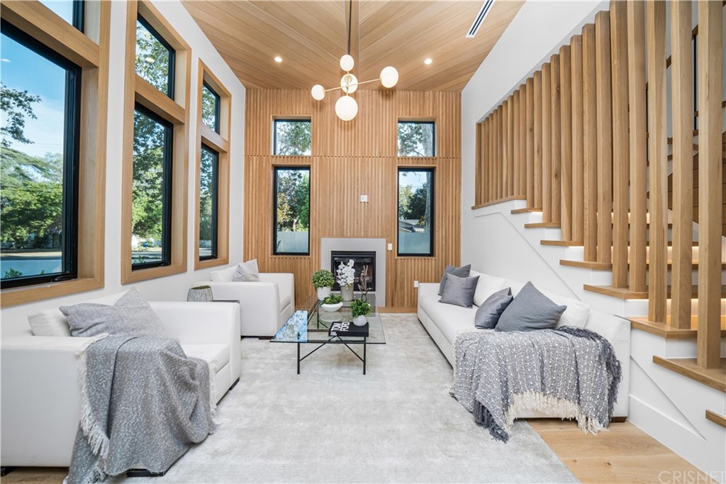 11201 Valley Spring Lane Studio City, CA 91602 - Photo 3 of 14 a spacious bedroom with furniture and large windows