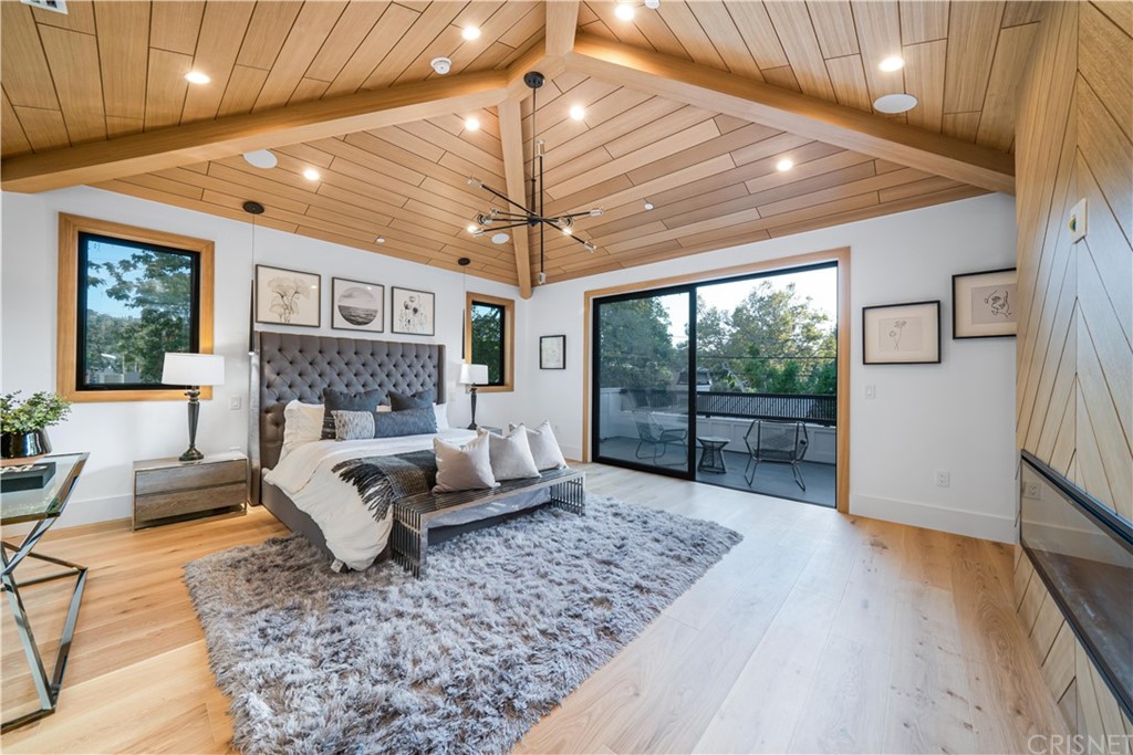 11201 Valley Spring Lane Studio City, CA 91602 - Photo 7 of 14 a living room with furniture and a large window