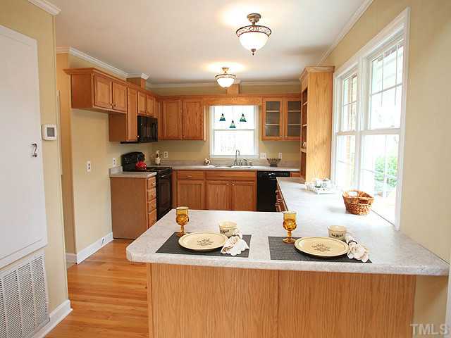 2512 Win Road Garner, NC 27529 - Photo 3 of 18 Kitchen with breakfast bar, bosch dishwasher.