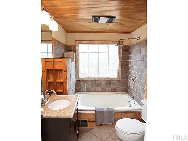 2512 Win Road Garner, NC 27529 - Photo 5 of 18 Upstairs full bath/shower with beautiful tiles and rain shower head.