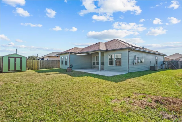 a house with swimming pool in front of it
