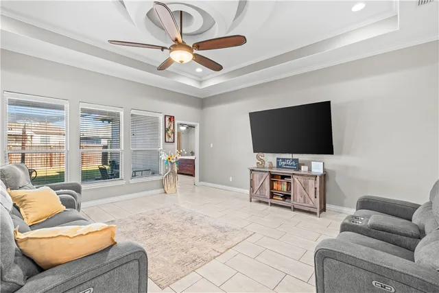a living room with furniture and a flat screen tv