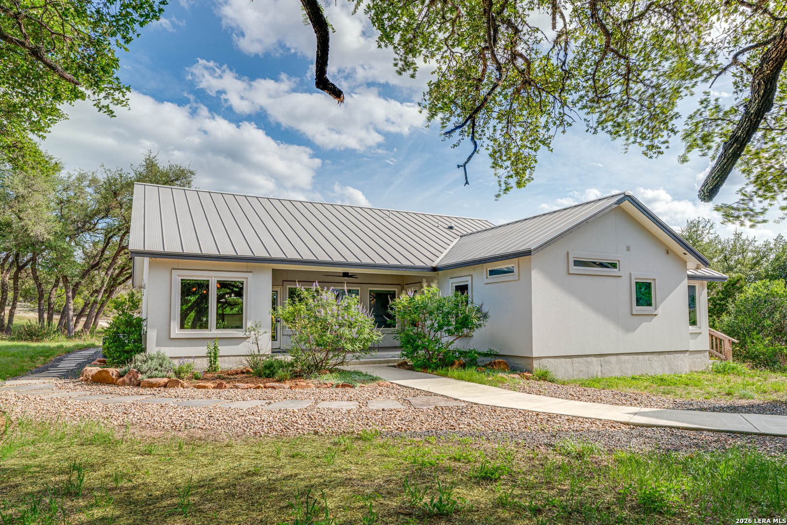 316 Prairie Tea Lane Spring Branch, TX 78070 - Photo 22 of 38 a view of a house with a yard plants and large tree