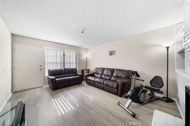 a living room with furniture and a mirror
