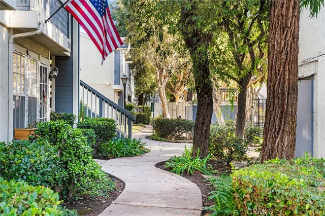 a front view of a house with a yard and outdoor seating