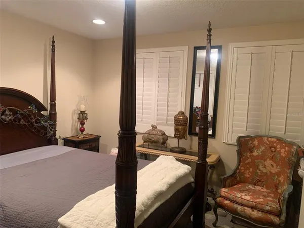 a view of living room with furniture and floor to ceiling window