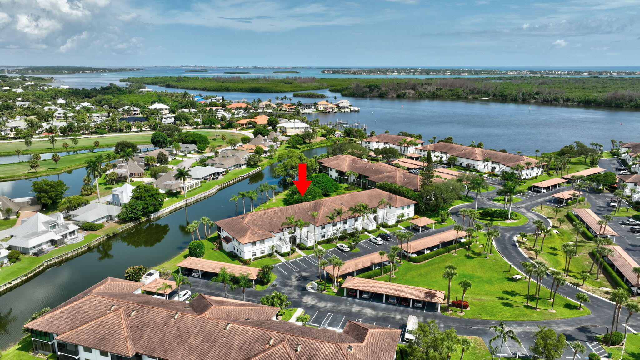6101 Southeast Landing Way, Unit 11 Stuart, FL 34997 - Photo 31 of 55 a view of a lake with a city view