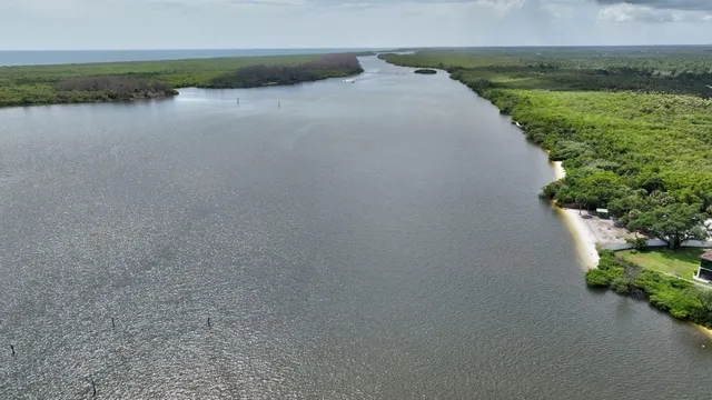 an aerial view of a house with a lake view