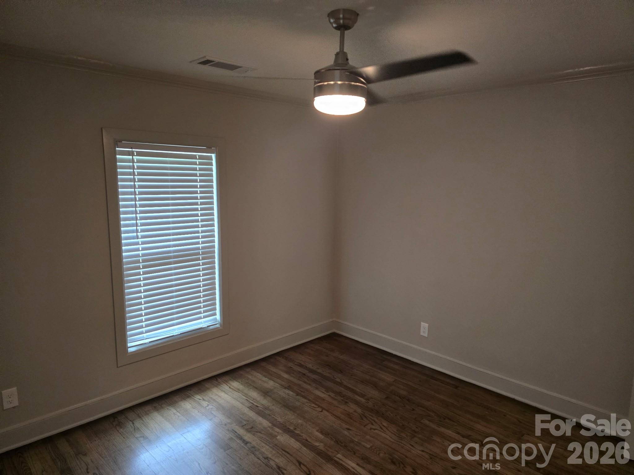 126 Sunset Drive Chester, SC 29706 - Photo 13 of 31 wooden floor in an empty room with a window