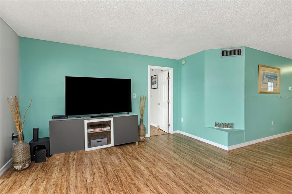 1900 68th Street North, Unit 110 St. Petersburg, FL 33710 - Photo 14 of 48 a view of a livingroom with furniture and flat screen tv