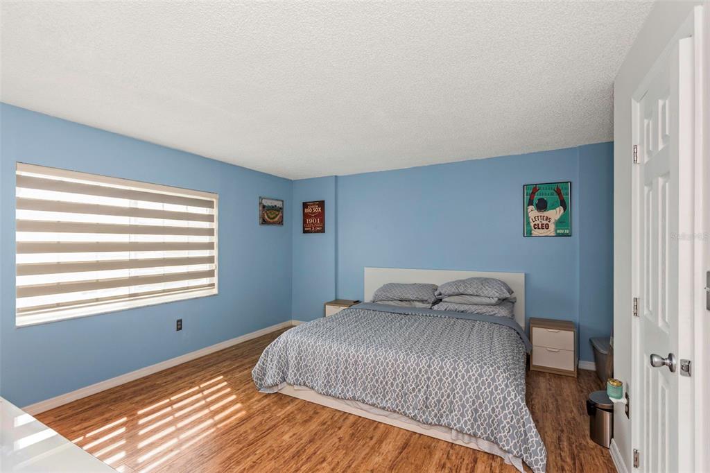 1900 68th Street North, Unit 110 St. Petersburg, FL 33710 - Photo 23 of 48 a bedroom with a bed and a window