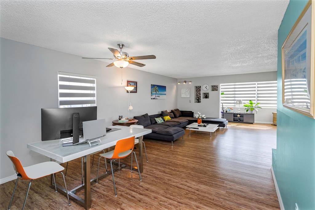 1900 68th Street North, Unit 110 St. Petersburg, FL 33710 - Photo 3 of 48 a living room with furniture and wooden floor