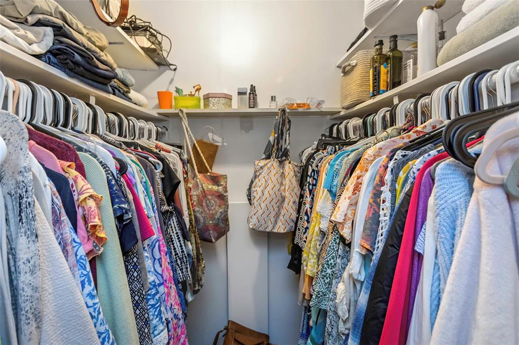 1900 68th Street North, Unit 110 St. Petersburg, FL 33710 - Photo 35 of 48 a view of walk in closet with clothes and shoes