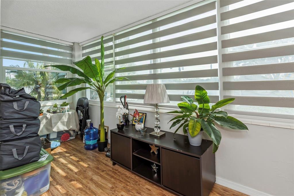 1900 68th Street North, Unit 110 St. Petersburg, FL 33710 - Photo 39 of 48 a vase of flowers sitting on a table in front of a window