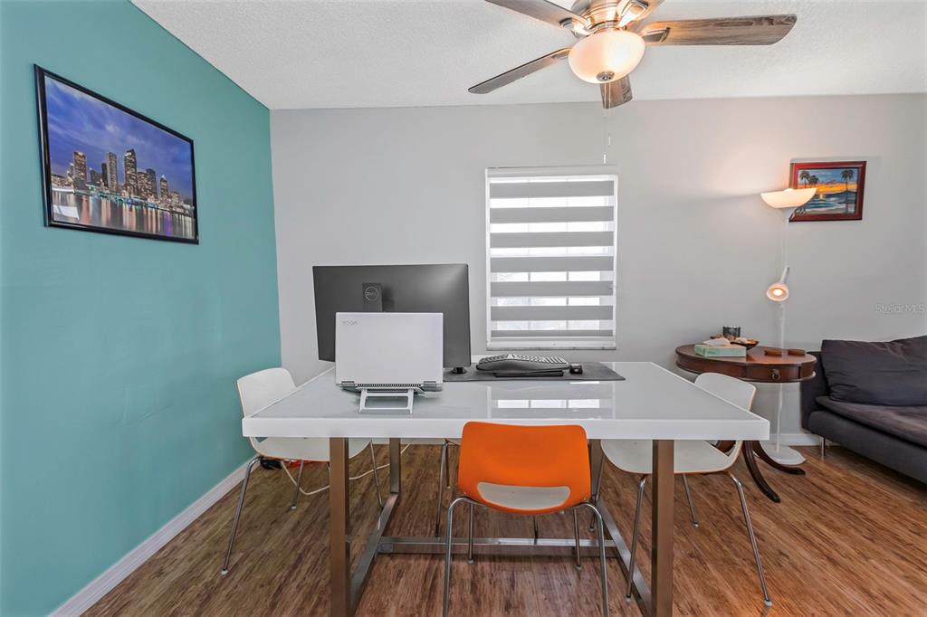 1900 68th Street North, Unit 110 St. Petersburg, FL 33710 - Photo 4 of 48 a workspace with furniture and wooden floor