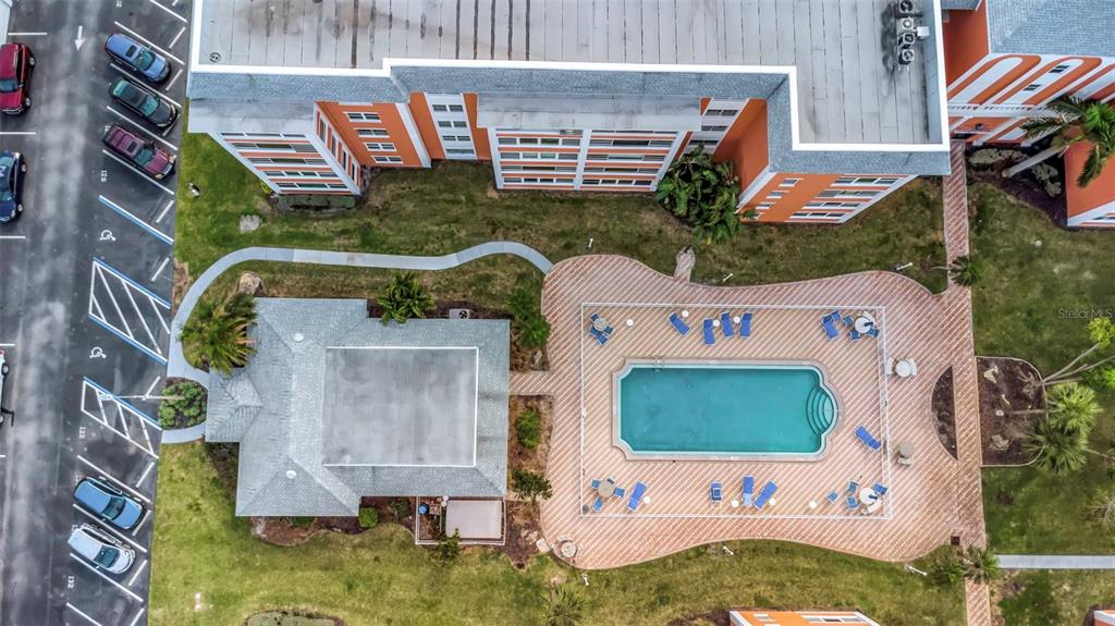 1900 68th Street North, Unit 110 St. Petersburg, FL 33710 - Photo 42 of 48 an aerial view of a house with outdoor space pool seating area and yard