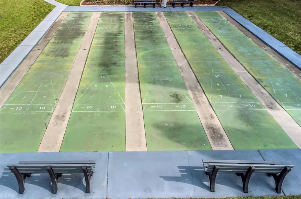 1900 68th Street North, Unit 110 St. Petersburg, FL 33710 - Photo 45 of 48 a backyard of a house with table and chairs