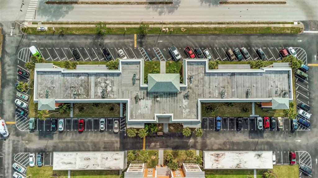 1900 68th Street North, Unit 110 St. Petersburg, FL 33710 - Photo 48 of 48 a view of swimming pool with outdoor seating