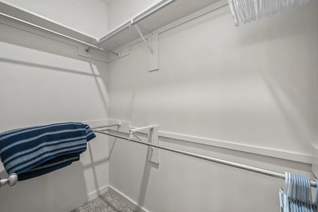 a view of utility room with racks on the wall