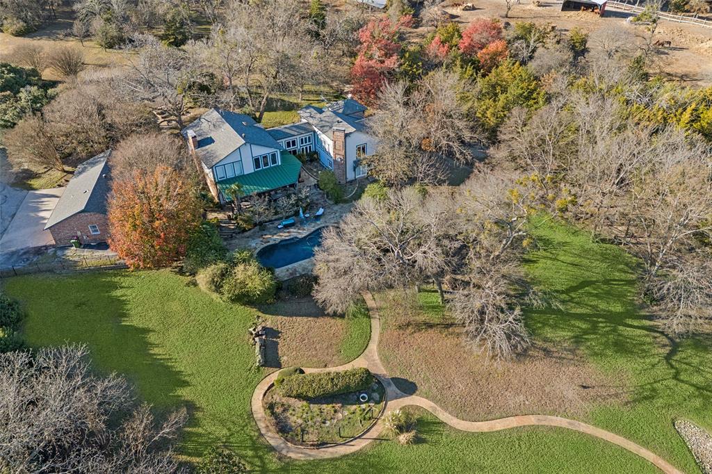 an aerial view of a house with outdoor space swimming pool and lake view
