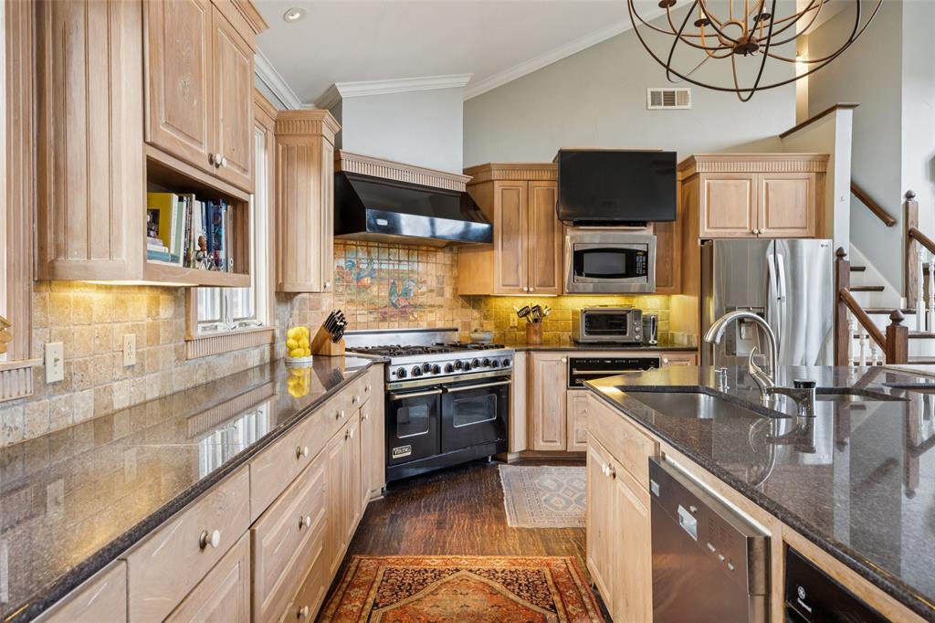 3580 Orr Road Fairview, TX 75002 - Photo 13 of 40 a kitchen with stainless steel appliances granite countertop a sink stove and refrigerator