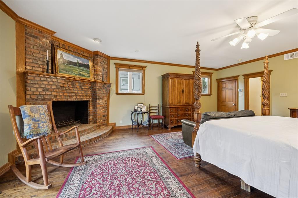 3580 Orr Road Fairview, TX 75002 - Photo 20 of 40 a spacious bedroom with a balcony a bed and a fireplace