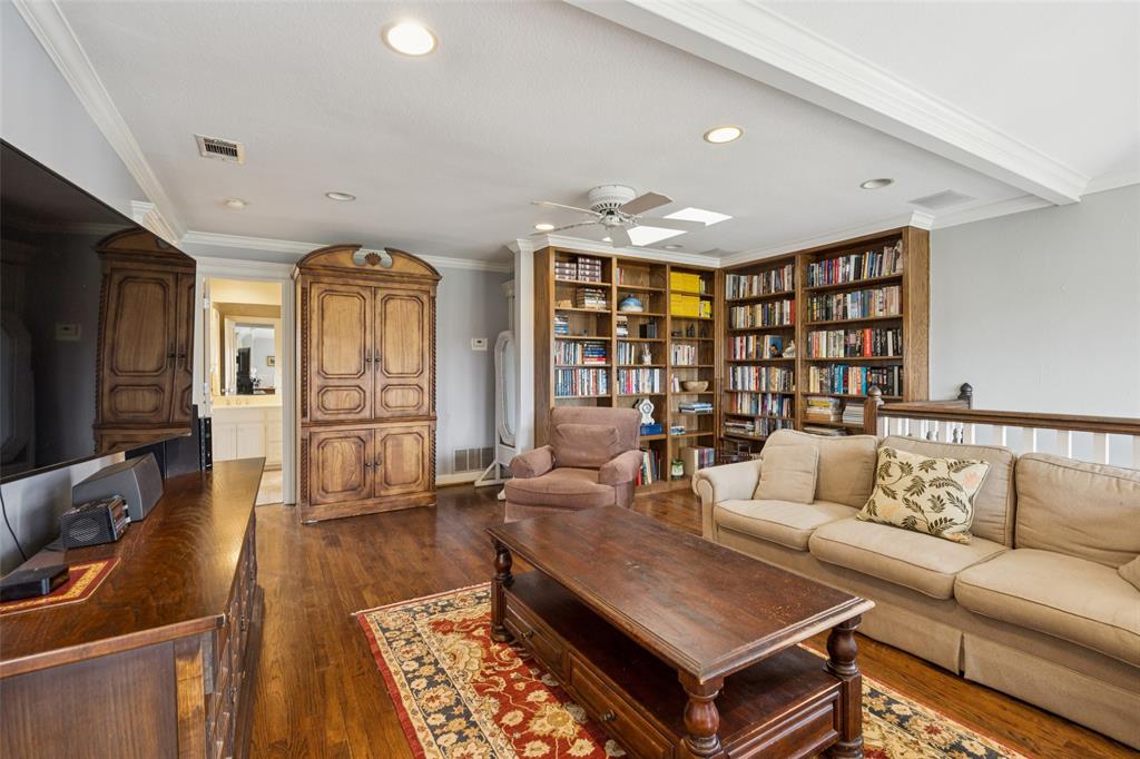 3580 Orr Road Fairview, TX 75002 - Photo 24 of 40 a living room with fireplace furniture and a flat screen tv