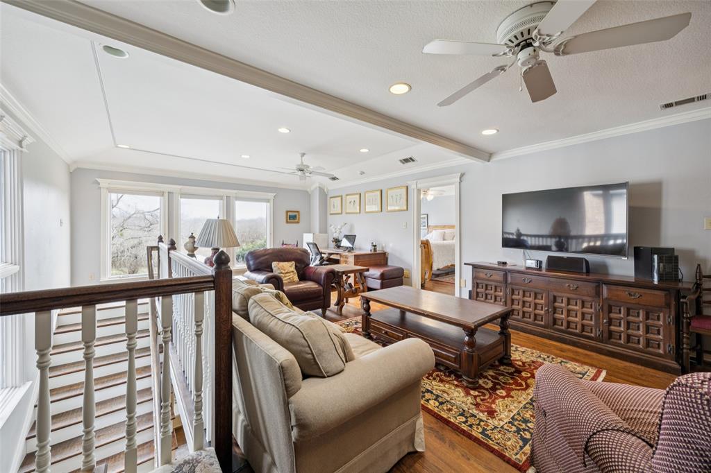 3580 Orr Road Fairview, TX 75002 - Photo 25 of 40 a living room with furniture ceiling fan and a rug
