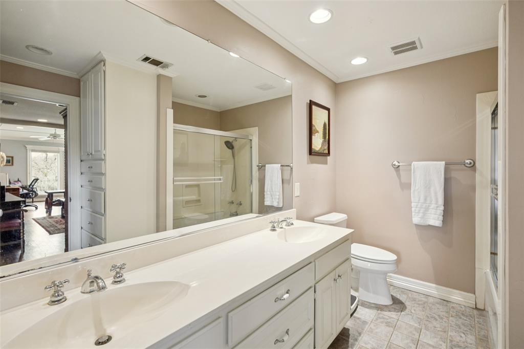 3580 Orr Road Fairview, TX 75002 - Photo 29 of 40 a bathroom with a double vanity sink toilet and shower