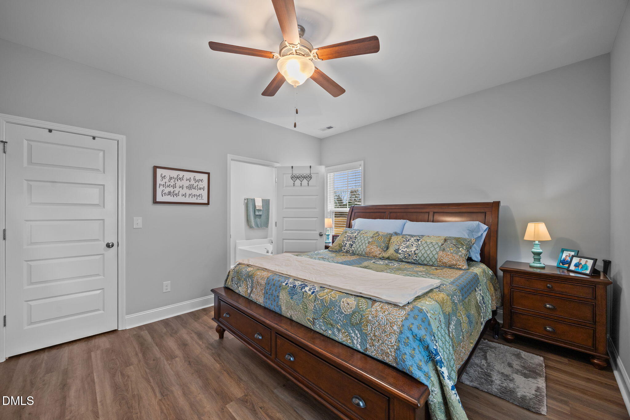 126 Arrow Lane Middlesex, NC 27557 - Photo 13 of 32 a bedroom with a bed and a chandelier