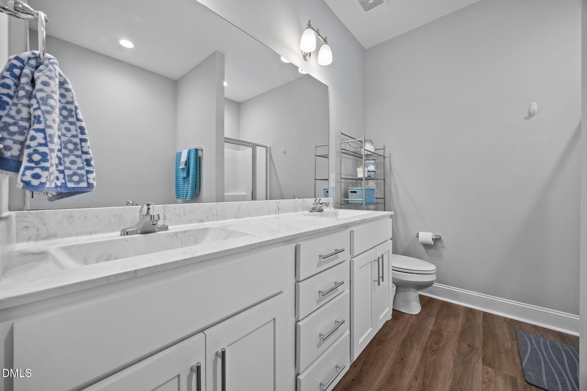 126 Arrow Lane Middlesex, NC 27557 - Photo 15 of 32 a bathroom with a double vanity sink and a mirror