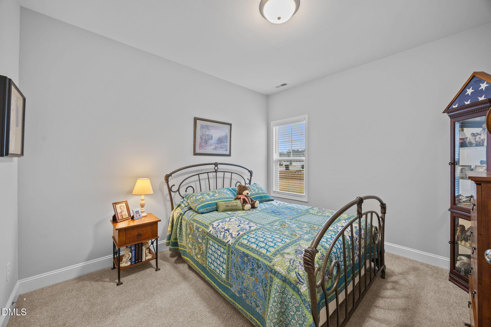 126 Arrow Lane Middlesex, NC 27557 - Photo 18 of 32 a bedroom with a bed and a table in it