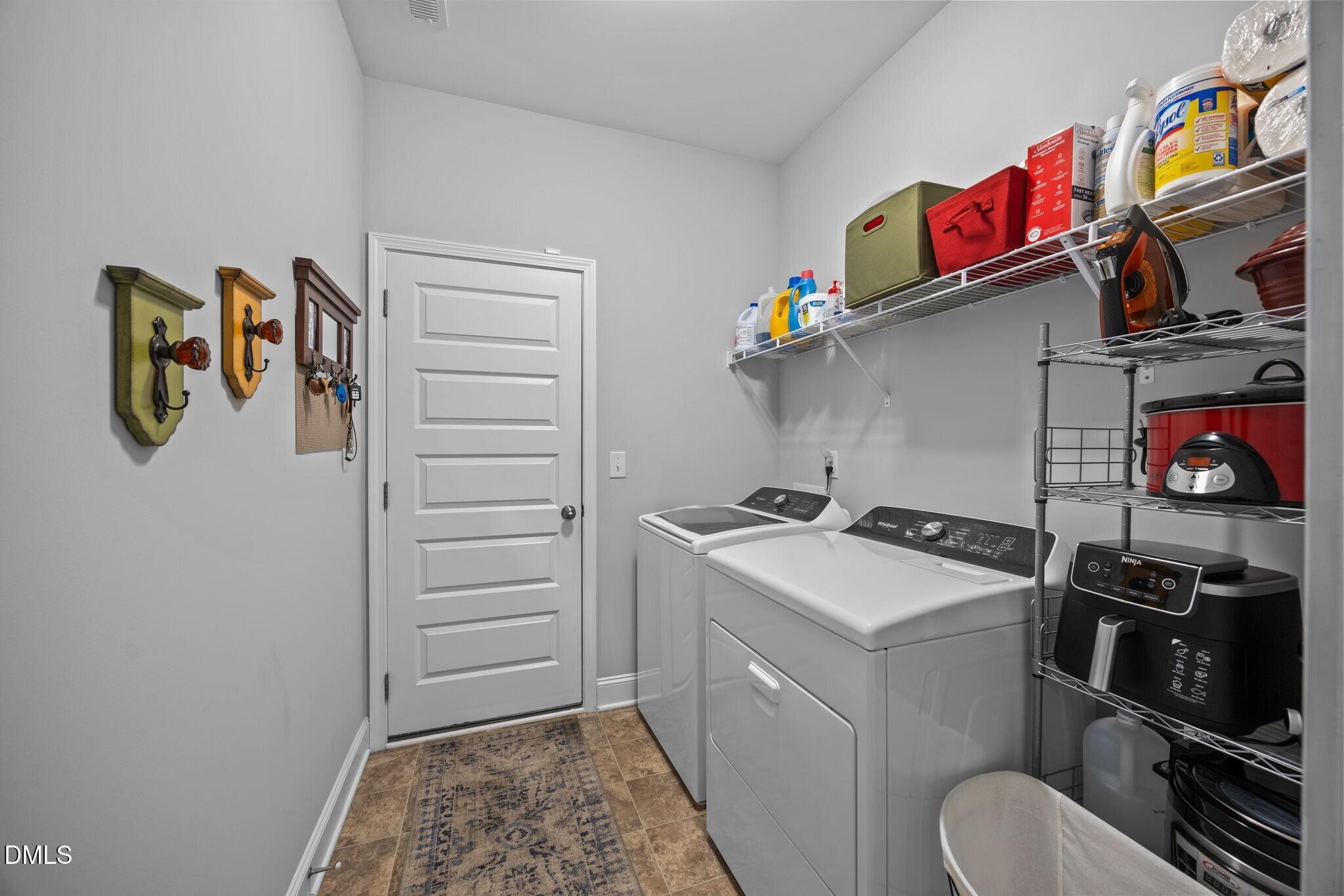 126 Arrow Lane Middlesex, NC 27557 - Photo 21 of 32 a utility room with dryer washer and stair
