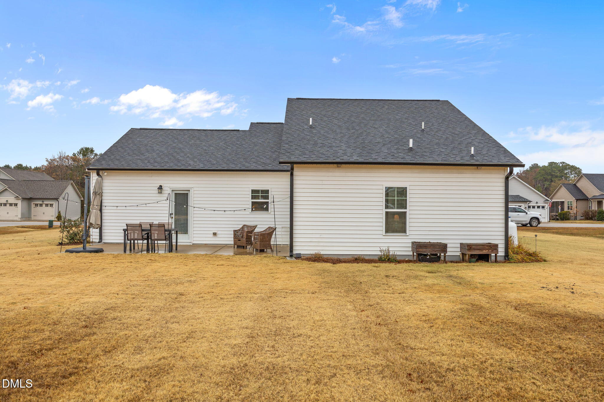 126 Arrow Lane Middlesex, NC 27557 - Photo 26 of 32 a view of a house with patio and a yard