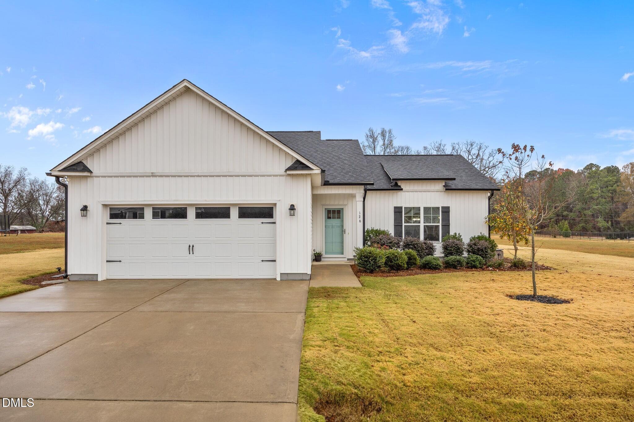 126 Arrow Lane Middlesex, NC 27557 - Photo 27 of 32 a front view of a house with a yard and seating area