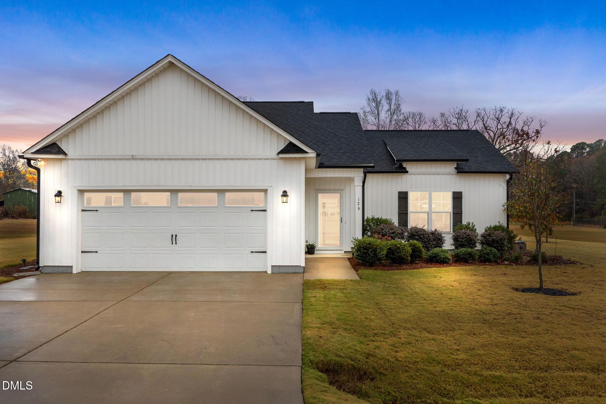126 Arrow Lane Middlesex, NC 27557 - Photo 2 of 32 a front view of a house with a yard
