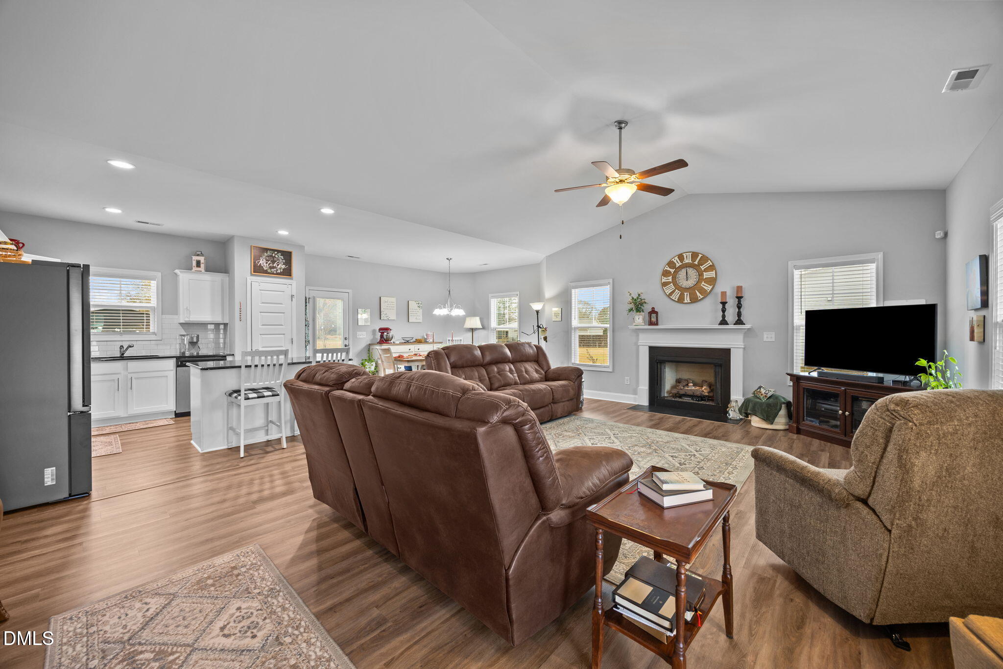 126 Arrow Lane Middlesex, NC 27557 - Photo 3 of 32 a living room with furniture a fireplace and a flat screen tv