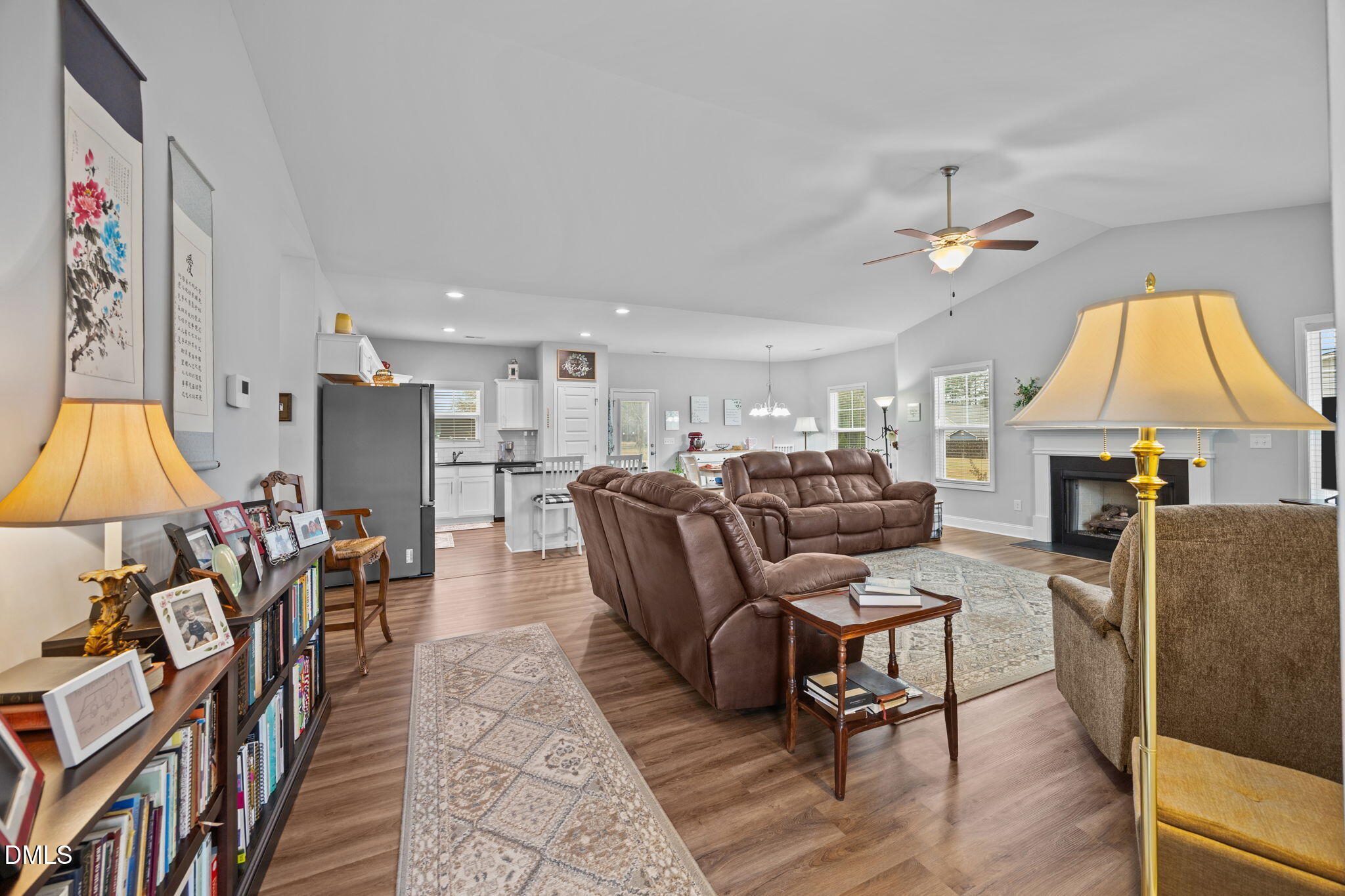 126 Arrow Lane Middlesex, NC 27557 - Photo 4 of 32 a living room with furniture a fireplace and a flat screen tv