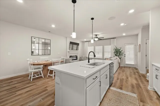 a kitchen with a sink and stove