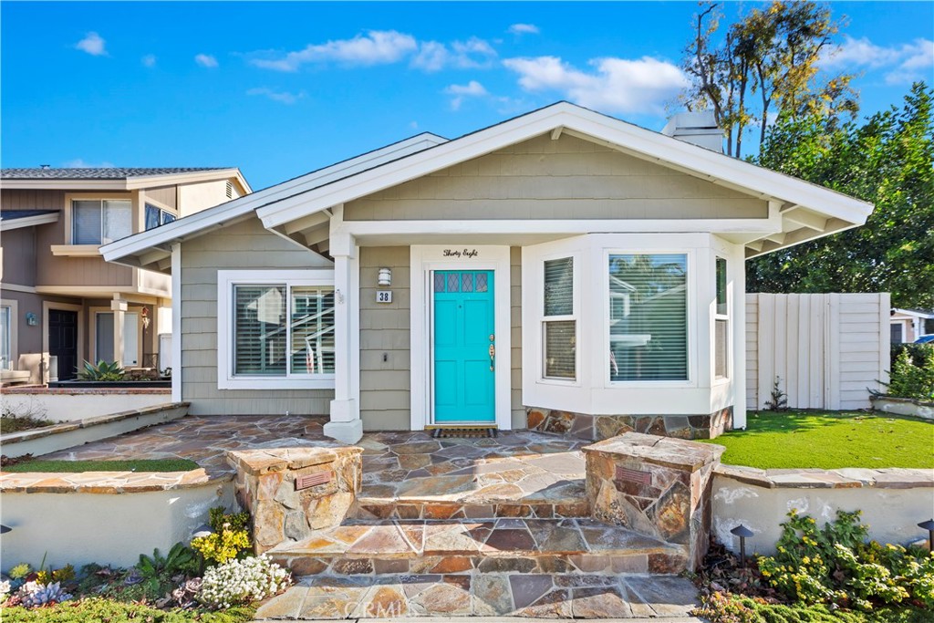 38 Racing Wind Irvine, CA 92614 - Photo 1 of 19 a front view of a house with a garden and patio