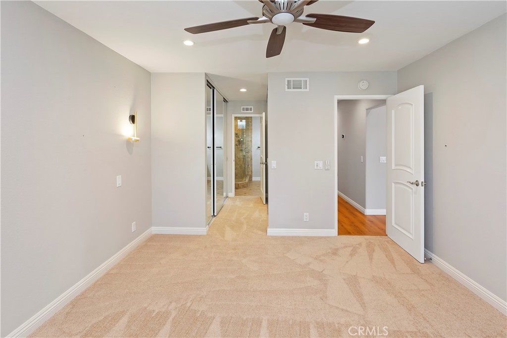 38 Racing Wind Irvine, CA 92614 - Photo 12 of 19 a view of an empty room and chandelier fan