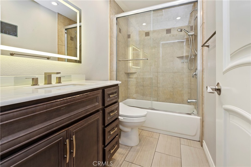 38 Racing Wind Irvine, CA 92614 - Photo 14 of 19 a bathroom with a sink a toilet and shower