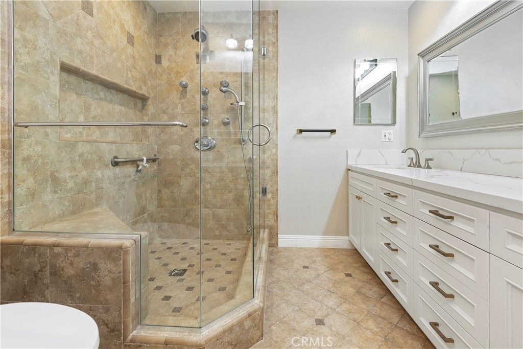38 Racing Wind Irvine, CA 92614 - Photo 15 of 19 a bathroom with a sink a toilet and shower