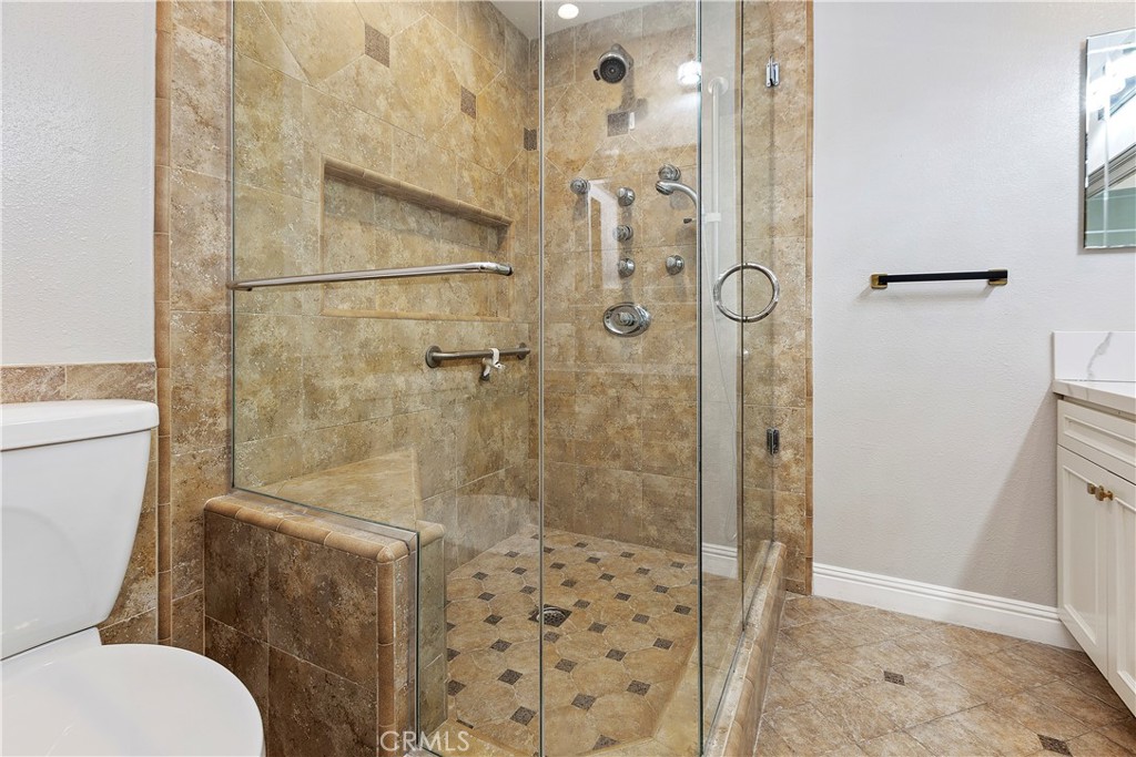 38 Racing Wind Irvine, CA 92614 - Photo 17 of 19 a bathroom with a shower and a toilet