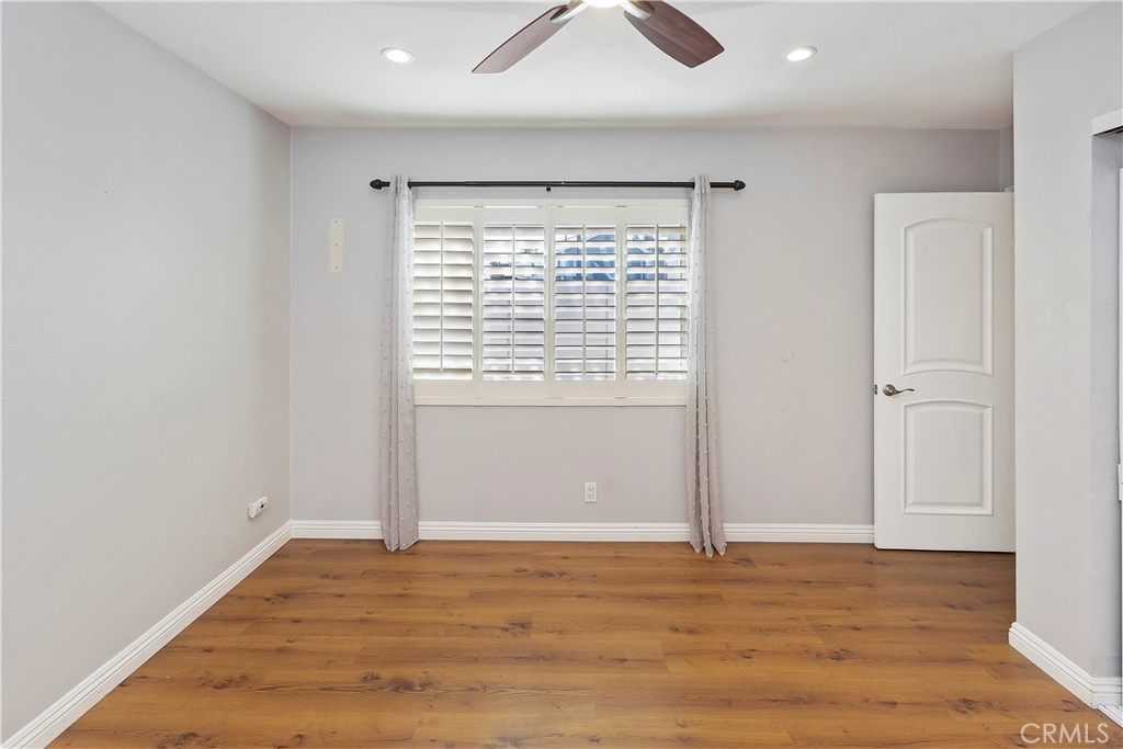 38 Racing Wind Irvine, CA 92614 - Photo 19 of 19 a view of an empty room with wooden floor and a window