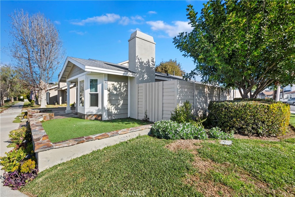 38 Racing Wind Irvine, CA 92614 - Photo 2 of 19 a front view of a house with garden