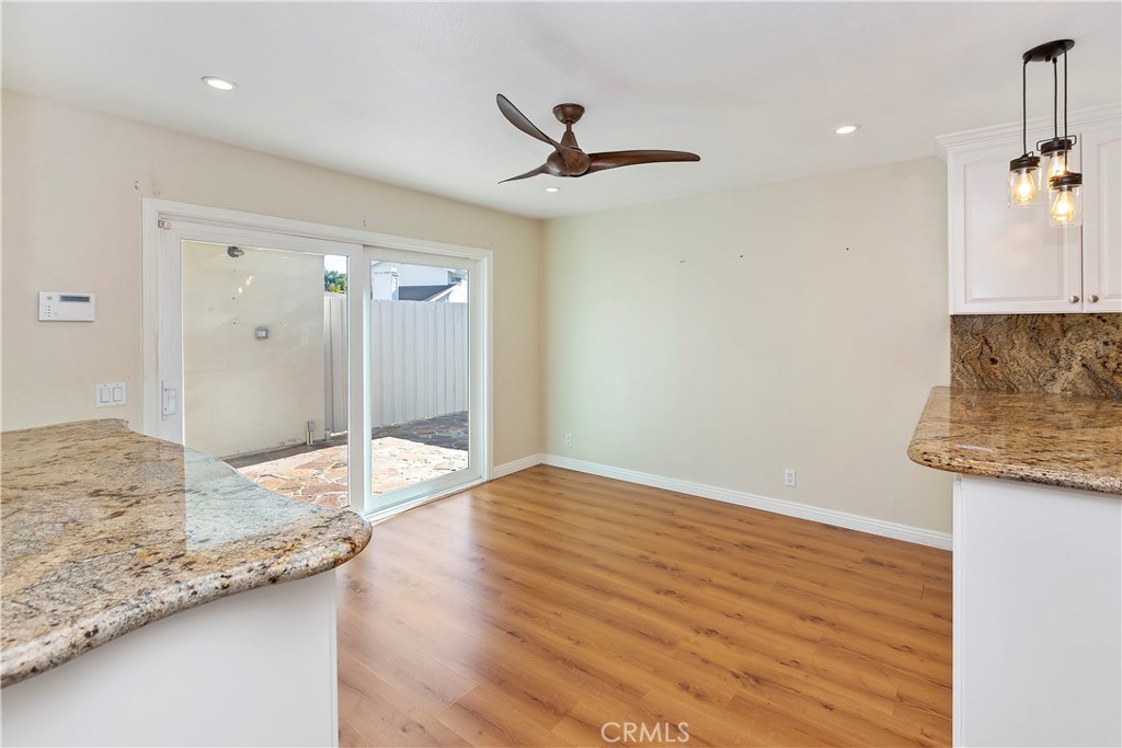 38 Racing Wind Irvine, CA 92614 - Photo 8 of 19 a bathroom with granite countertop a sink and a mirror