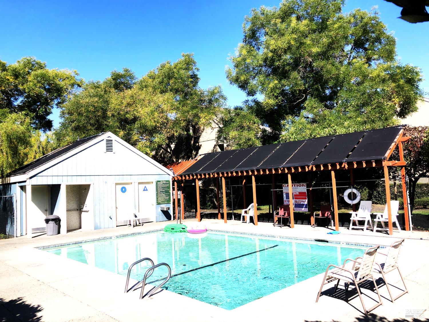 7645 Camino Colegio Rohnert Park, CA 94928 - Photo 12 of 14 a view of a house with floor to ceiling windows and a basket ball poll