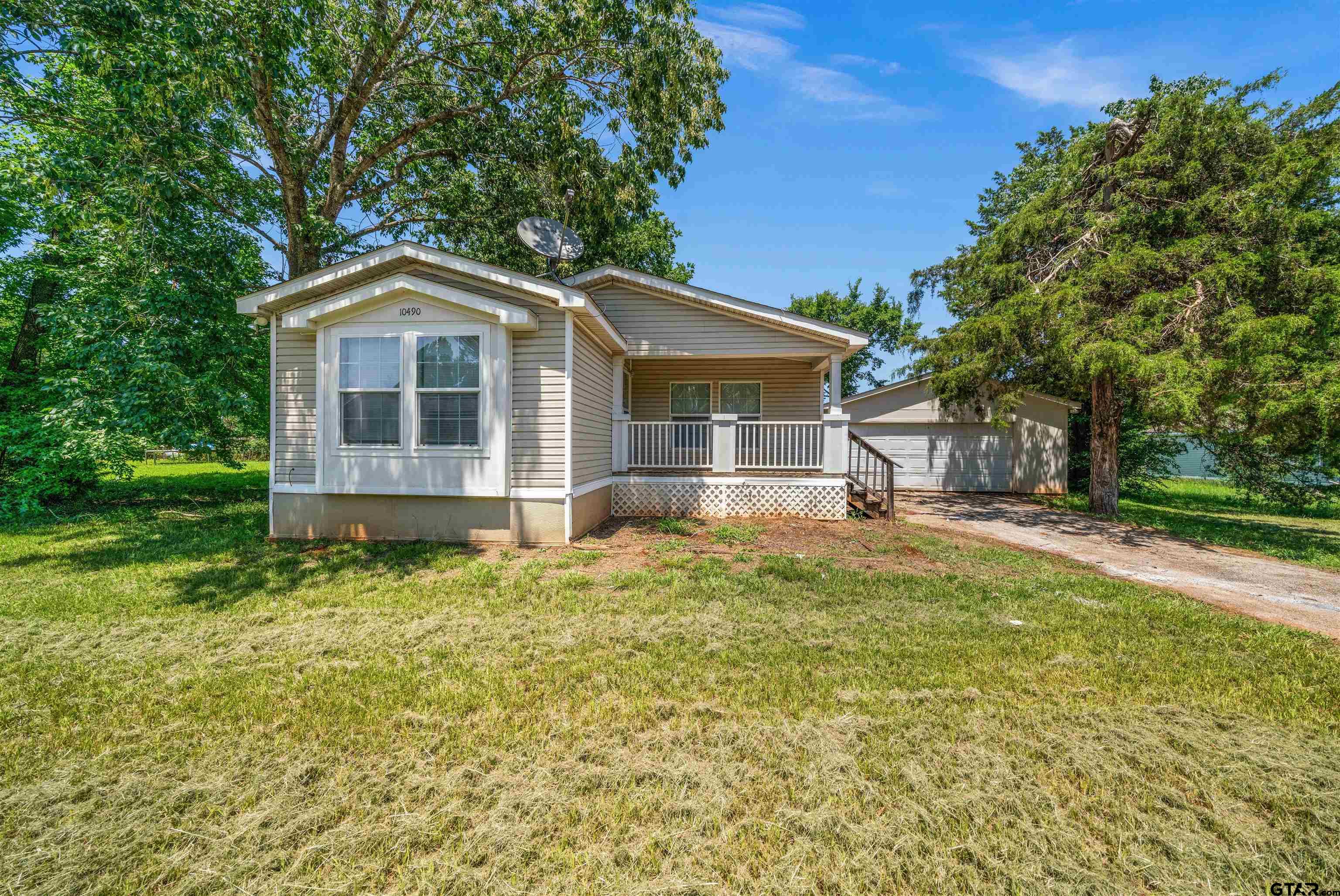 10490 Peterson Tyler, TX 75708 - Photo 1 of 30 a front view of a house with a yard